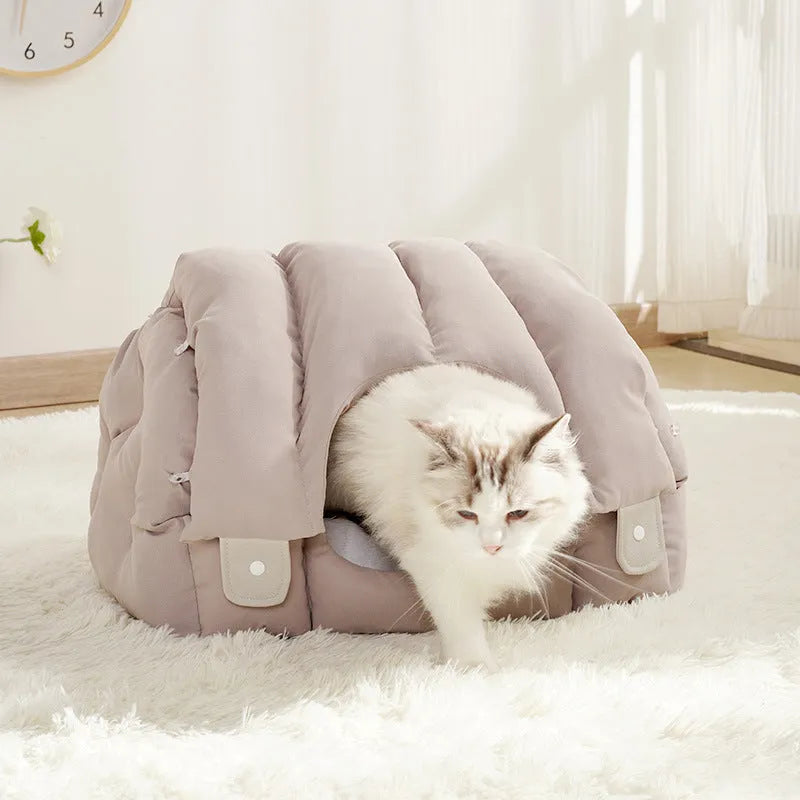 Dual-purpose arched pet bed showing enclosed cat nest section and open sofa-style area