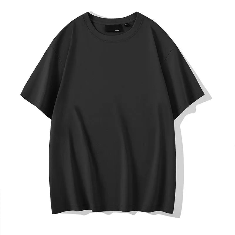 Solid colour loose fit cotton t-shirt with round neck and drop shoulder sleeves on a hanger