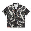 Snake bone floral pattern printed on light blue polyester Cuban collar shirt with short sleeves