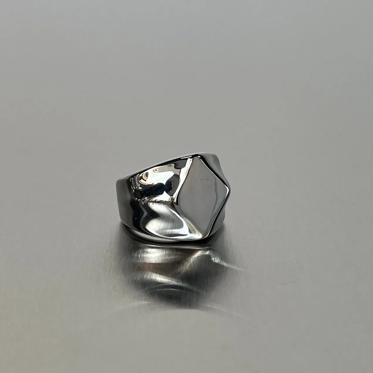 Smooth plain titanium steel ring in sizes 7 to 11, shown in square, oval, round and curved style options.