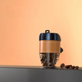 Coffee cup shaped car air freshener with solid coffee beans fragrance in brown colour on car dashboard