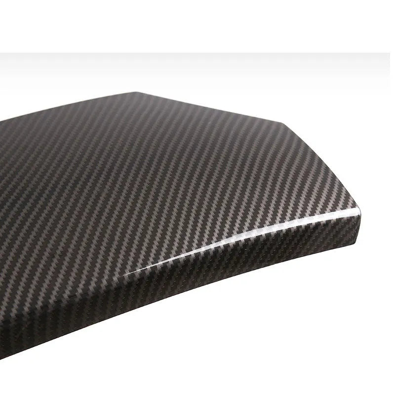 Three ABS carbon fibre pattern armrest covers showing diagonal weave texture and polished surface