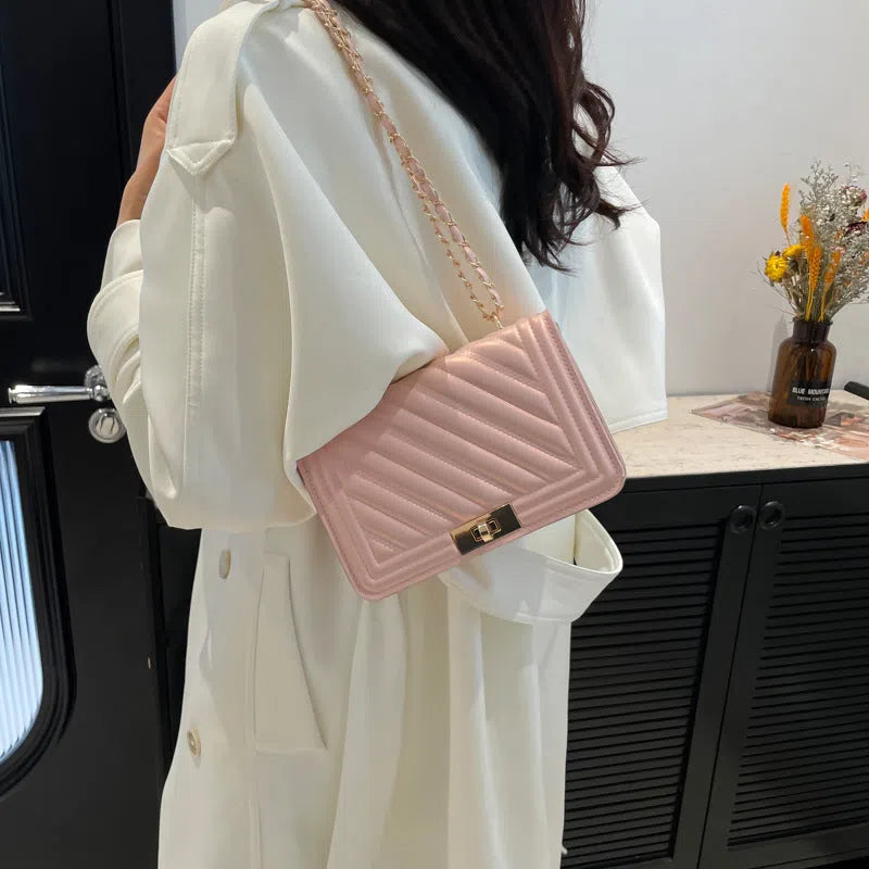 Single shoulder crossbody bag in PU with stitching detail, horizontal rectangle shape, shown in one of 14 colours