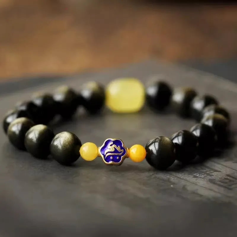 Golden obsidian bracelet with hand-carved Chinese zodiac animal beads in geometric shapes