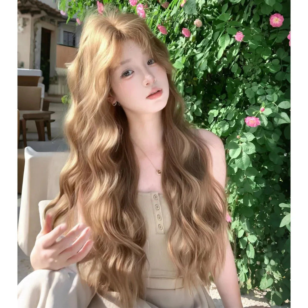 Medium size long curly wig in linen colour made from high temperature synthetic fibre.