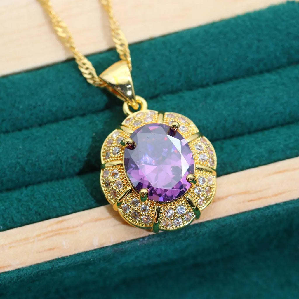 18k gold plated four-piece jewellery set with synthetic cubic zirconia stones in Raytheon cut, showing necklace, earrings, ring, and bracelet