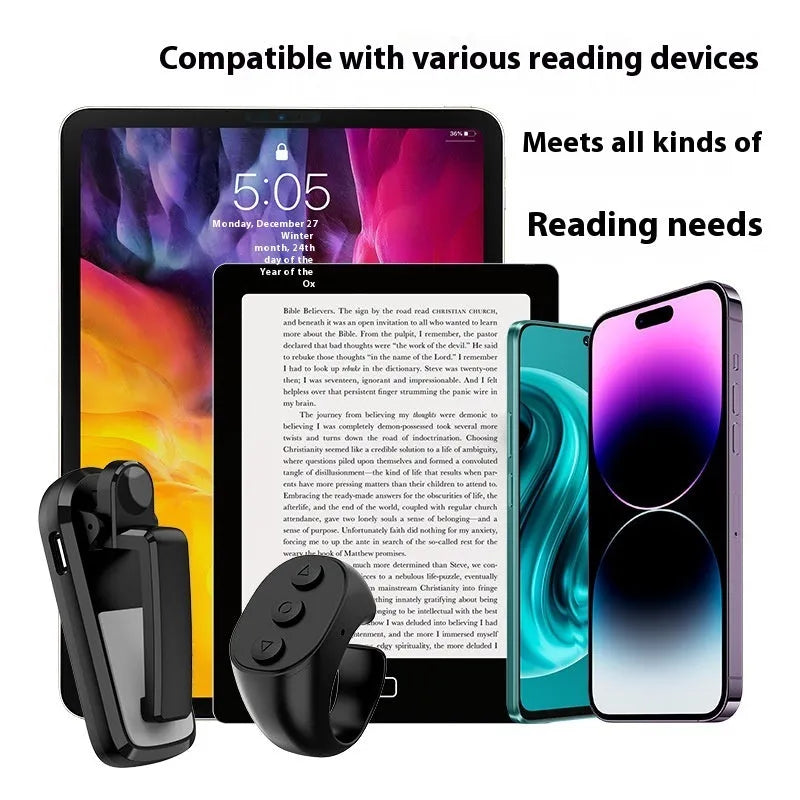 Black wireless page turner remote control and a small clicker on a wooden table.
