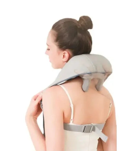Milky white rechargeable shoulder and neck kneading massager with USB cable.