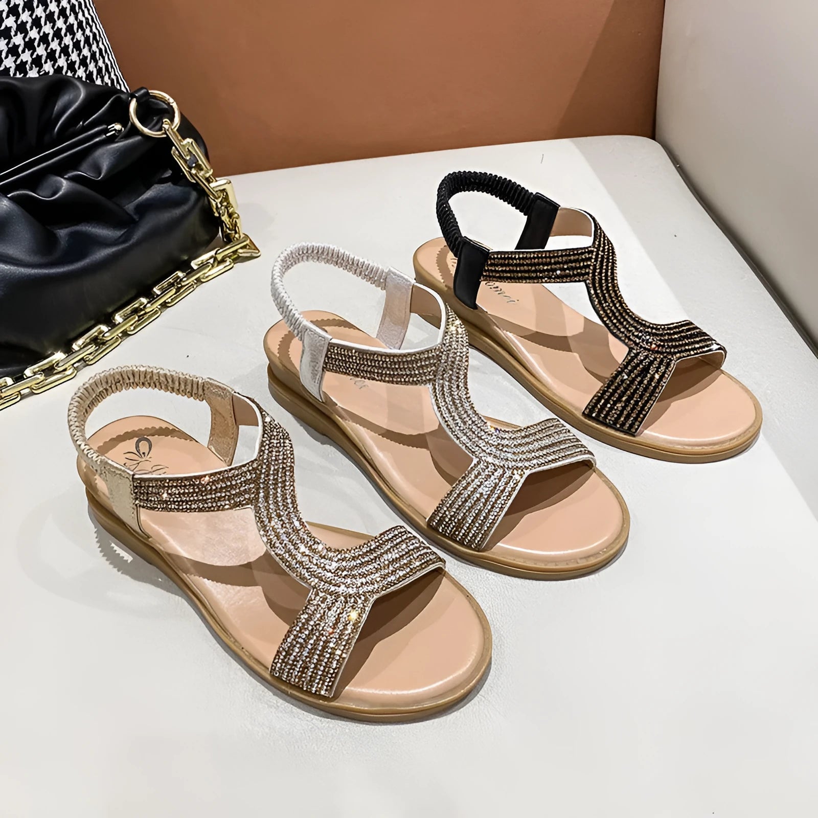 Women's gold patent leather sandals with rhinestone decoration and a non-slip sole.