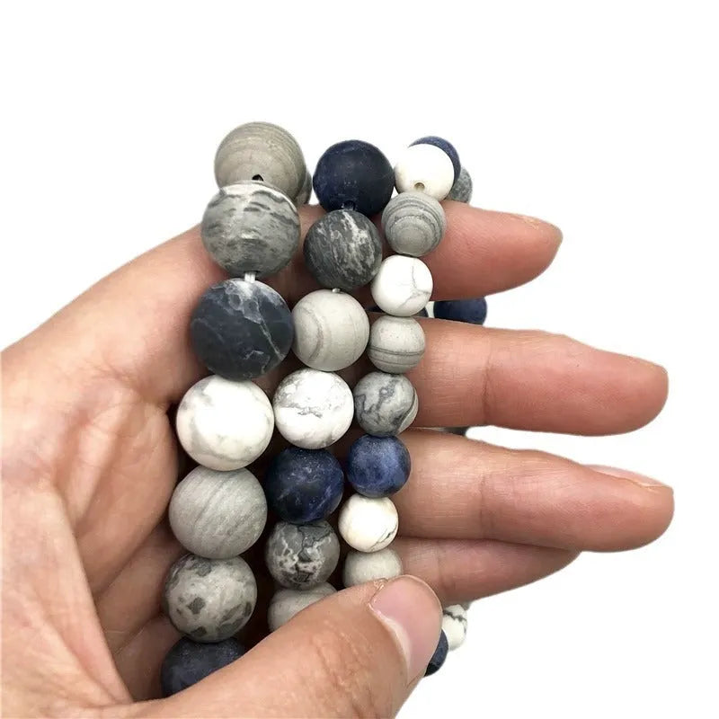 Handmade planet stone bracelet with universe wind pattern showing U-shaped design