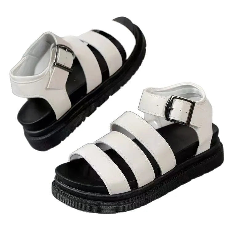 Black outdoor sandals with thick rubber sole and adjustable strap buckle closure showing round toe design