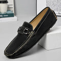 Men's beige slip-on loafers with a round toe and rubber sole on a plain background.