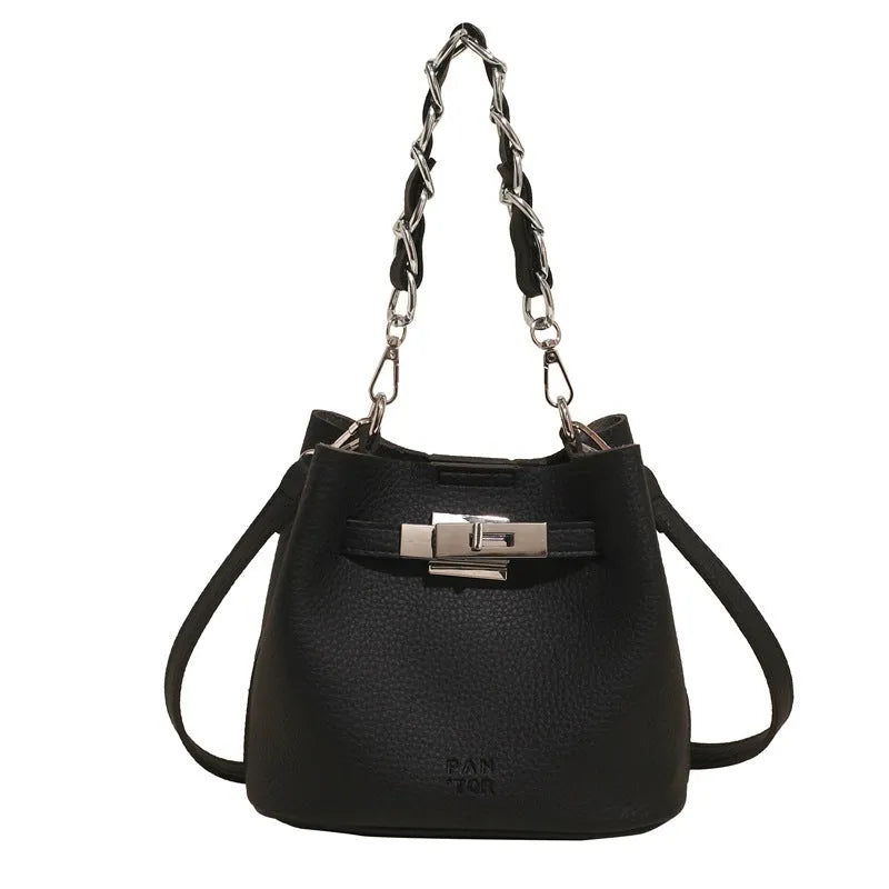 Soft black PU leather retro bucket shoulder bag showing interior phone and zipped pockets.