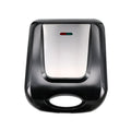 Black countertop nut roasting machine measuring 31cm by 26cm by 11cm.