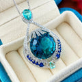Women's geometric pendant necklace with bright blue fireworks-cut crystal and electroplated water wave chain