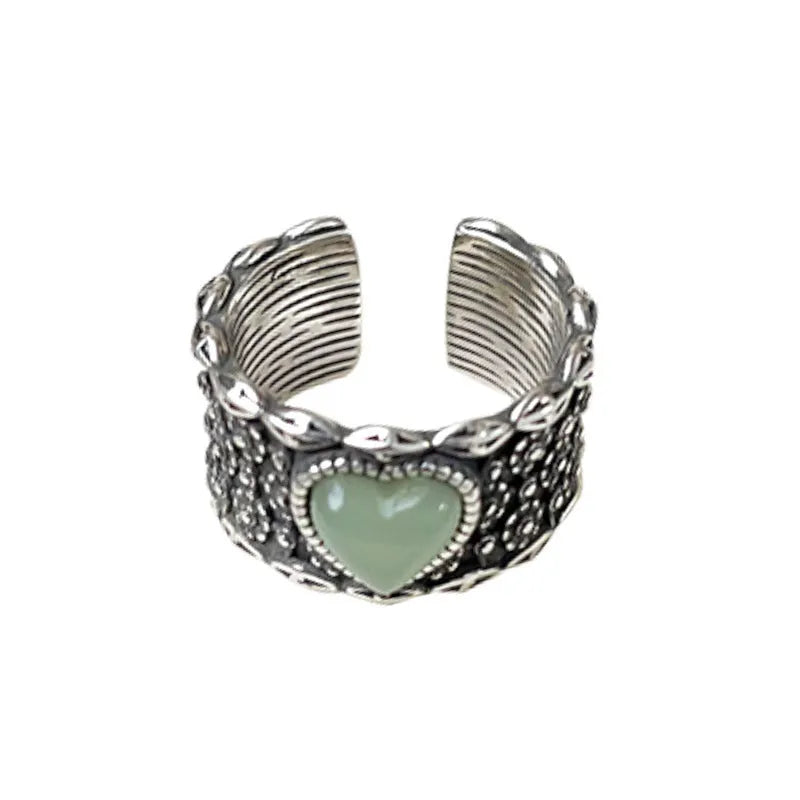 Retro wide-faced heart-shaped ring with adjustable opening in white copper plated silver, showing love-themed details