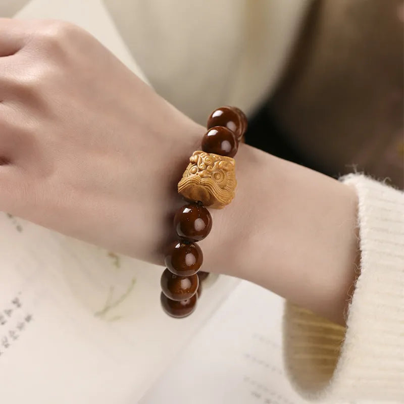 Hand-woven ivory nut lion round bead artistic bracelet with 13mm spherical beads
