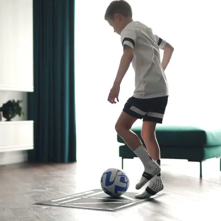 Black football training mat measuring 60x90cm with non-slip backing for ball control drills