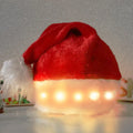 Red and white plush Santa hat with LED lights glowing around the brim and decorative pompom