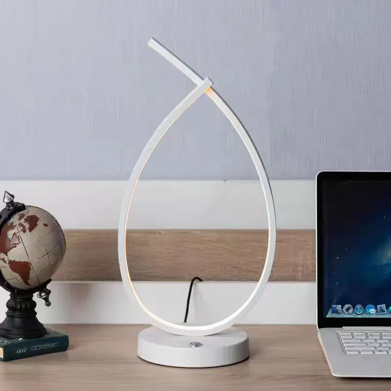 Small black or white creative desk lamp with USB cable, 30cm tall on a wooden table.