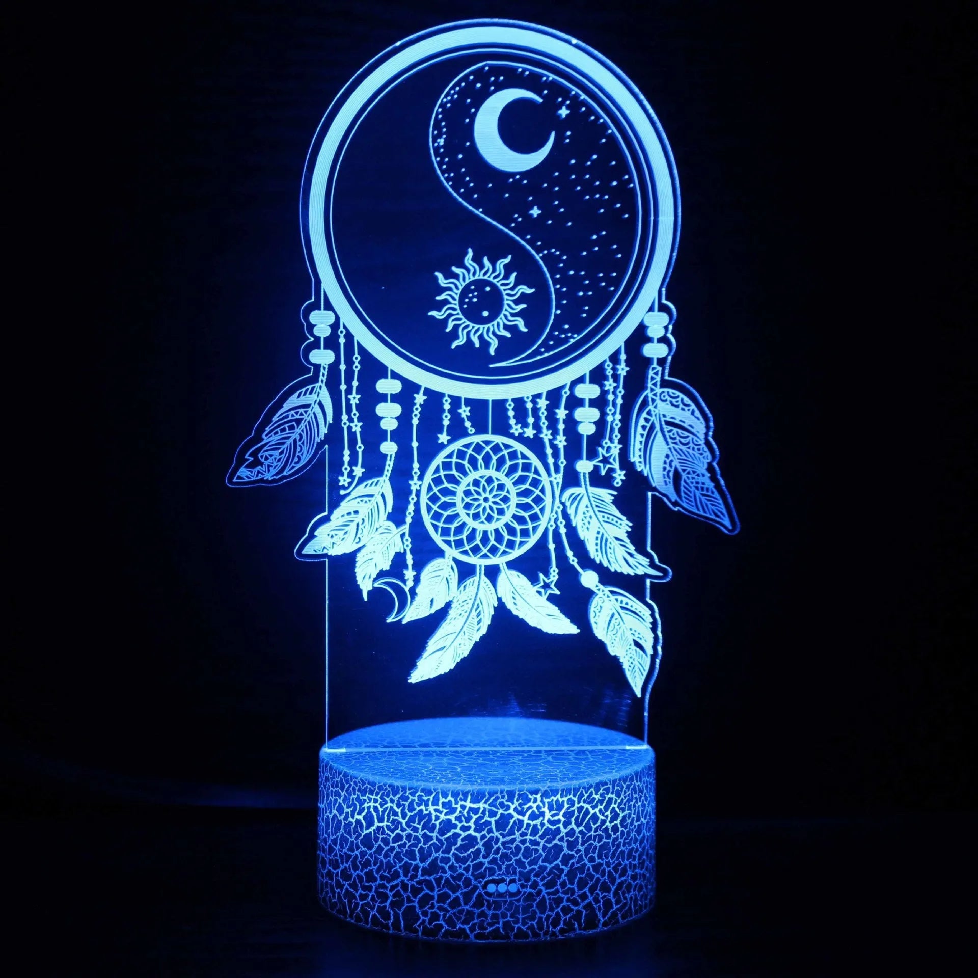 Cartoon-style 3D LED night light with black touch base and remote control on a bedside table.