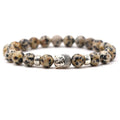 Tigereye Buddha Head stretch bracelet with 8mm natural stone beads on a wrist, showing the Buddha head charm and elastic design.