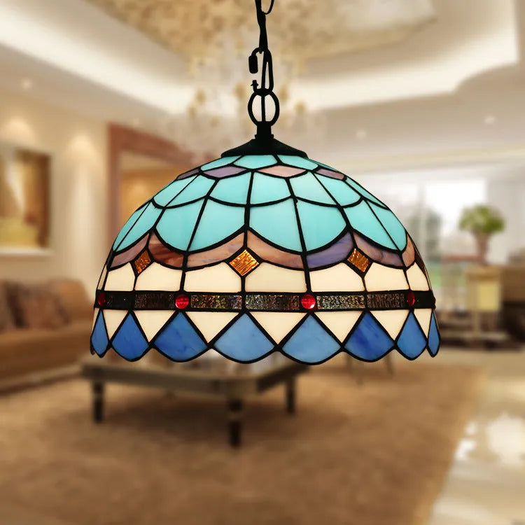 European baroque style chandelier with coloured glaze finish and abstract modelling.
