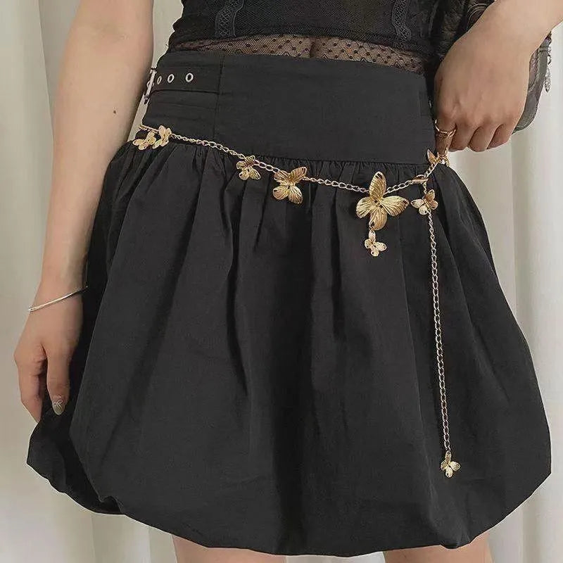Golden butterfly waist chain with adjustable clasp, 104cm length, on a model showing retro style.