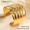 Gold plated wide women's bracelet with asymmetric geometric design and a niche opening.