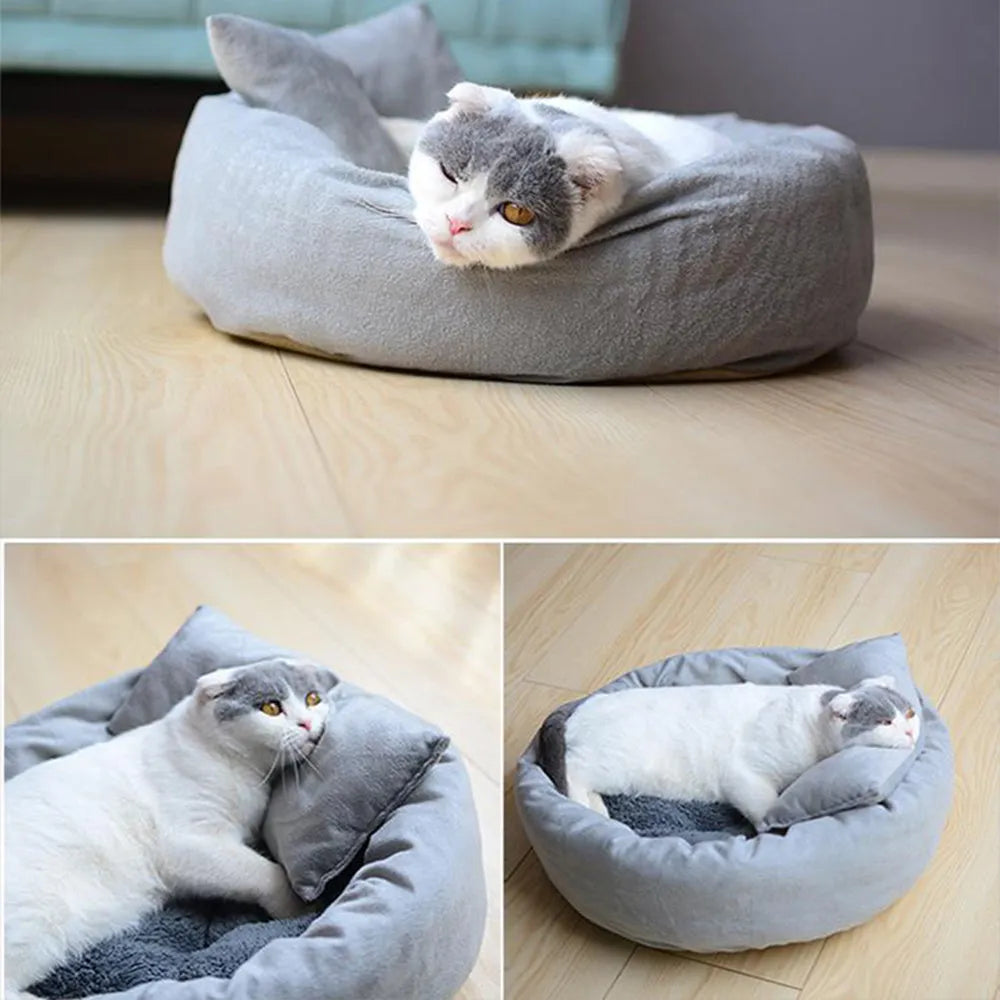 Grey round pet bed for small dogs and cats with raised edges and removable pillow on non-slip base