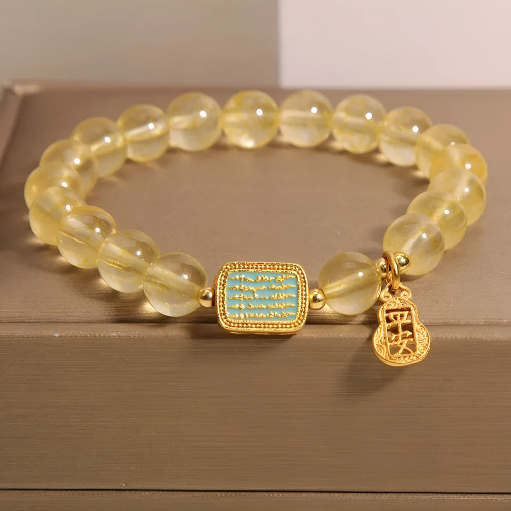 Yellow citrine crystal women's bracelet with rhinestone detailing on wrist