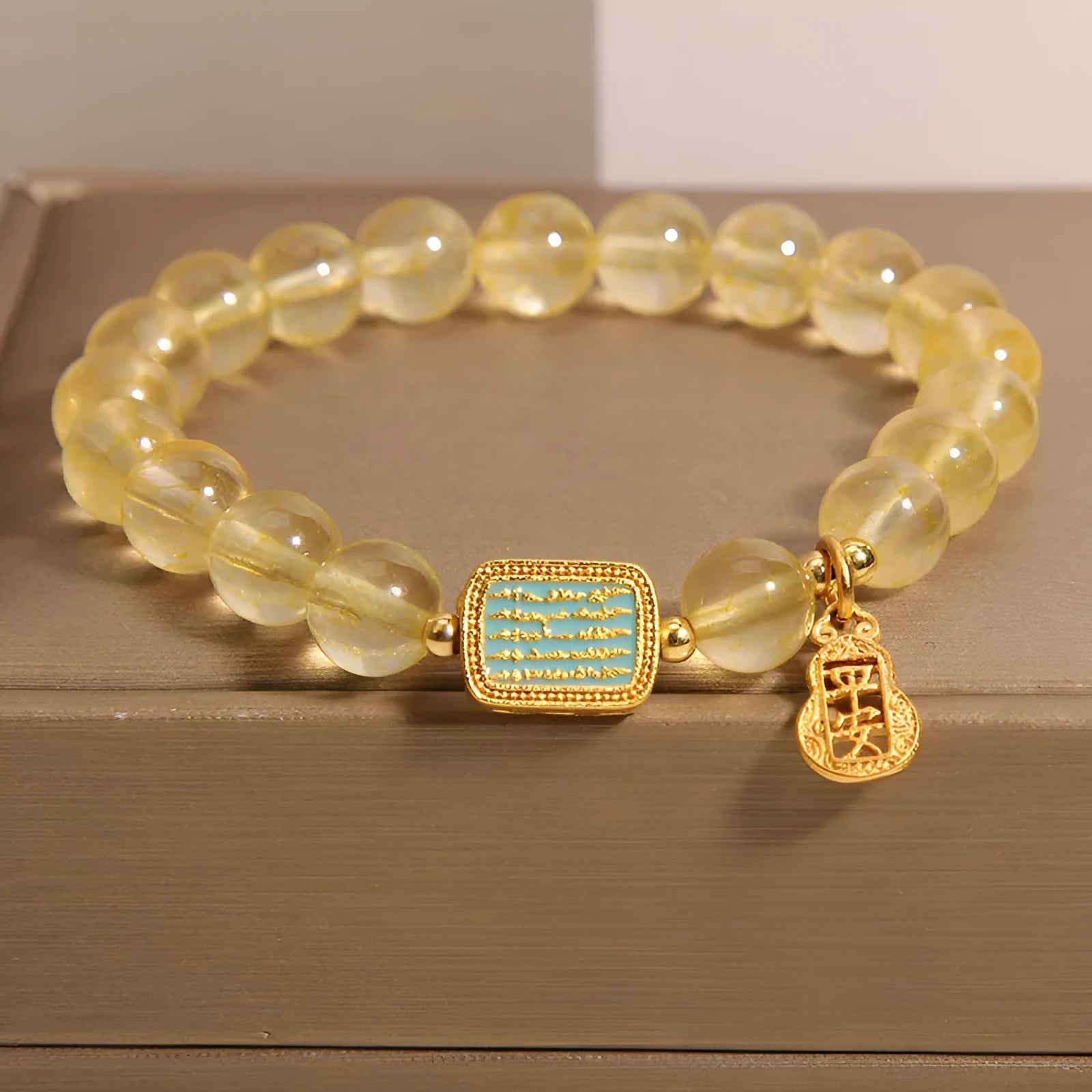 Yellow citrine crystal women's bracelet with rhinestone detailing on wrist