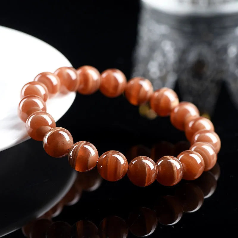 Natural rhodochrosite bracelet with round manganese spar beads and Ruyi decorative elements