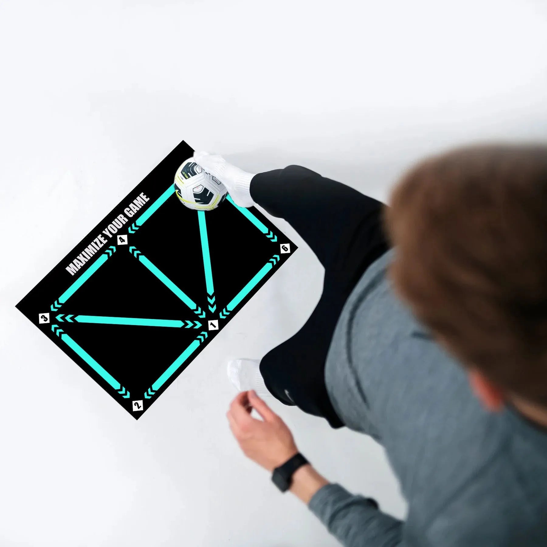 Black football training mat measuring 60x90cm with non-slip backing for ball control drills