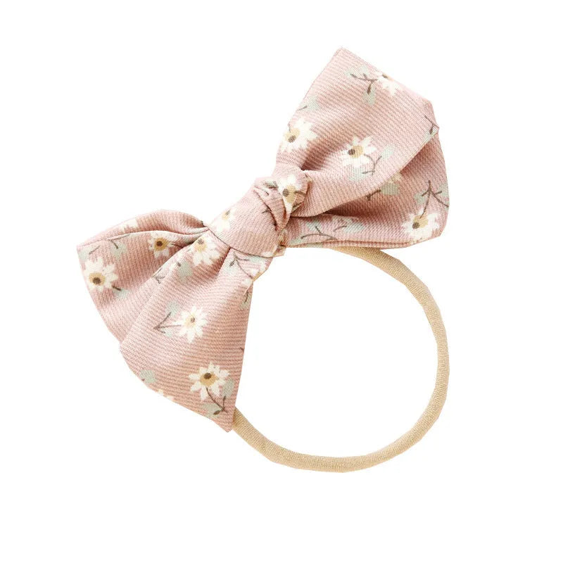 Children's cloth knotted bow hair ring in a Snow White princess print.