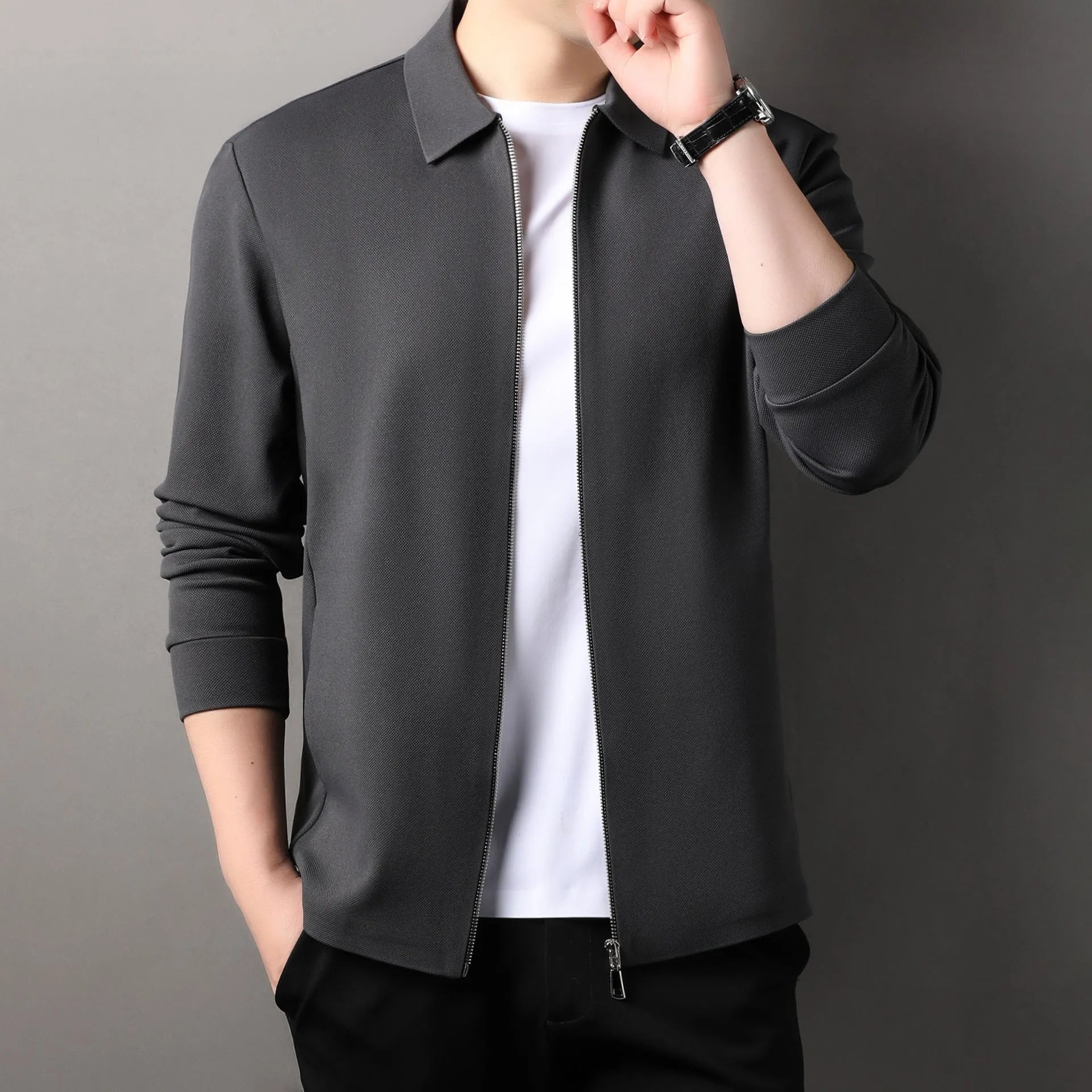 Men's jacket in apricot colour with straight hem and long sleeves, made from polyester fibre, shown on a hanger.