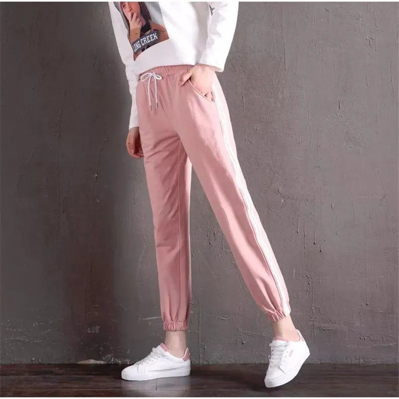 Women's cropped harem track pants in thin polyester, mid waist, solid colour, sizes S to 3XL