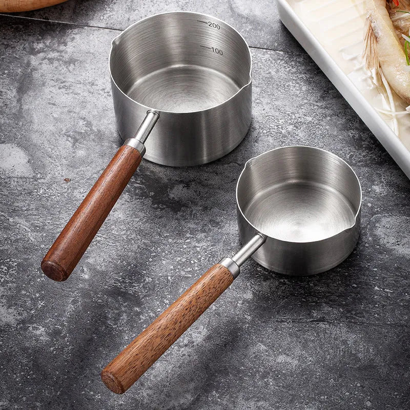 304 stainless steel dog food scoop with wooden handle and measuring cup design for dry pet food, small and large sizes available.