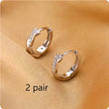 Geometric hemp rope earrings with interwoven design on copper frame, gold plating option shown