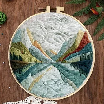 Embroidery DIY landscape kit with bamboo-style frame, pre-printed cotton fabric, embroidery threads, and needles