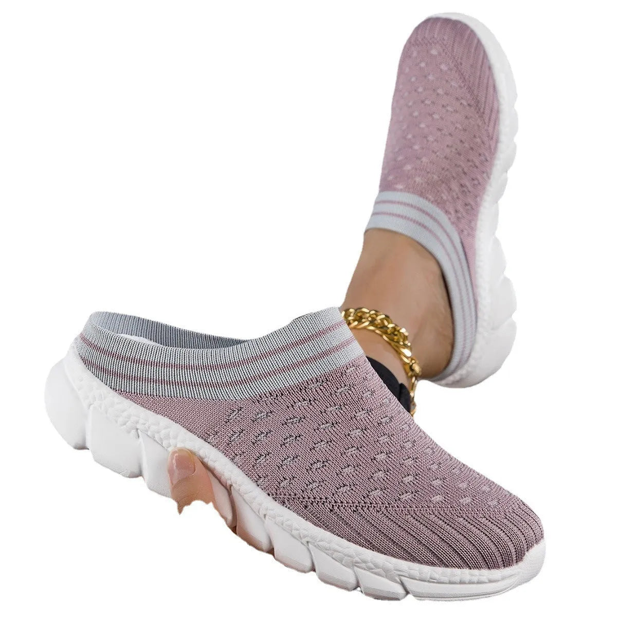 Women's black Flyknit slipper shoes with striped pattern and hollowed-out design on a white background.