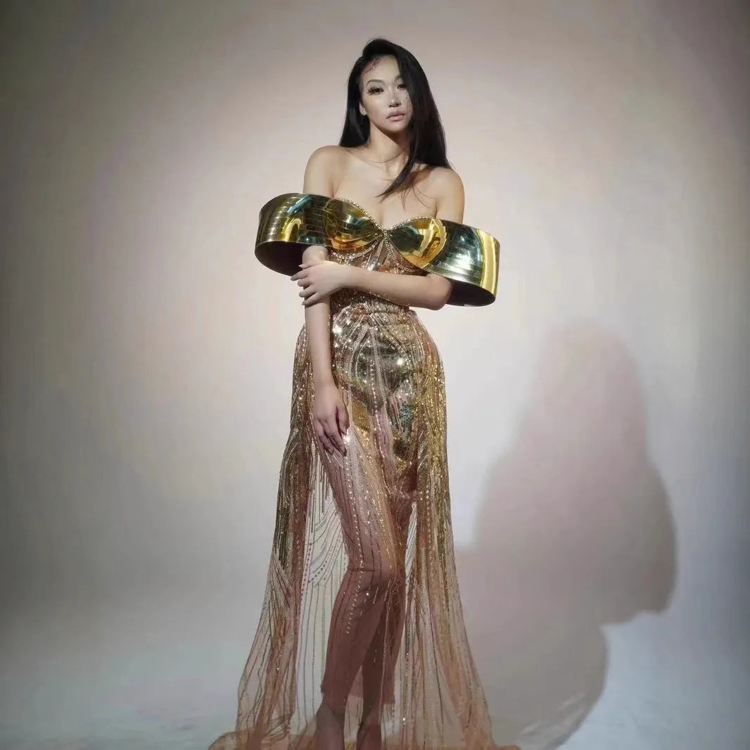 Gold strapless sequin dress with tulle overlay and a long split skirt