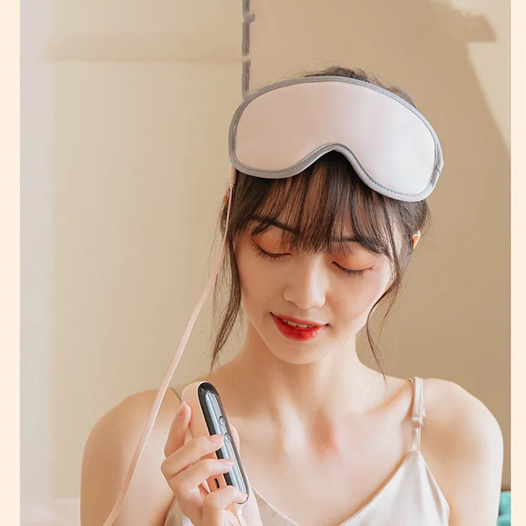 Portable eye SPA mask in green or pink with adjustable heating and vibration settings, showing 93mm by 200mm size