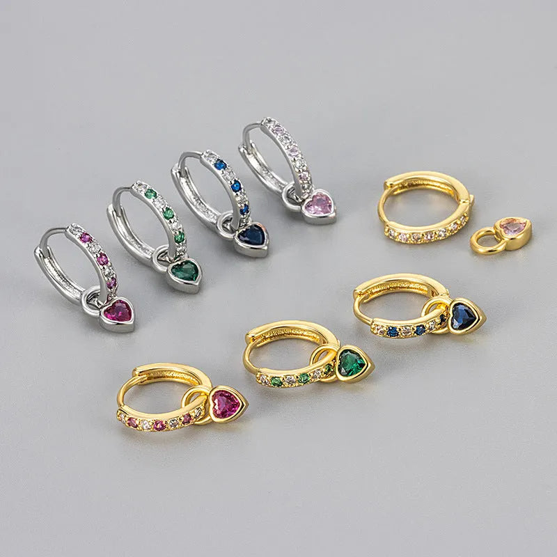 Fashion zircon earrings with heart-shaped eardrops in gold or white gold colour settings with diamond-treated gemstones