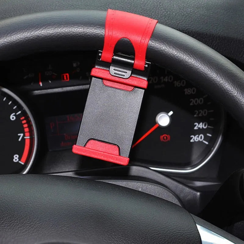 Black steering wheel phone mount with adjustable clip and 360-degree ball joint holding mobile device