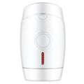 White home IPL laser hair removal device on a table.