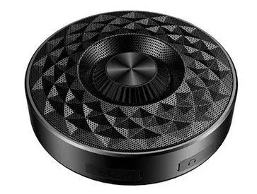 Black Bluetooth mini speaker with control buttons on top, measuring 10cm by 5cm