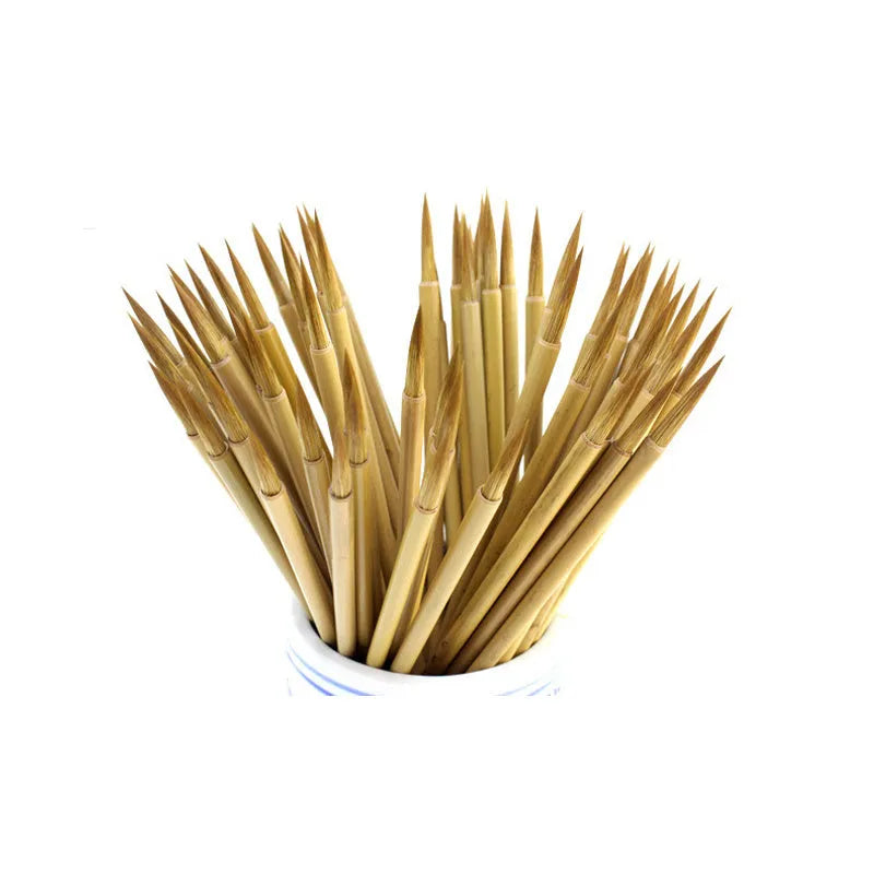Langhao traditional Chinese calligraphy brush with wolf hair nib, shown beside ink and paper.