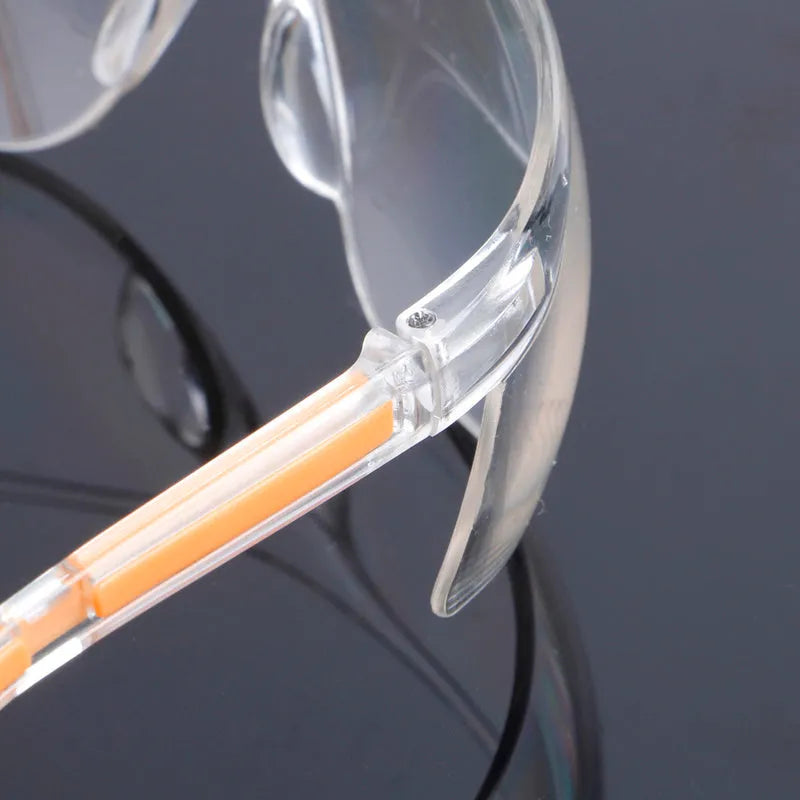 Transparent yellow safety goggles made of polycarbonate for eye protection.