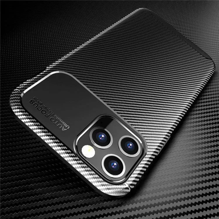Black silicone iPhone 12 case with simple beetle design on a table.